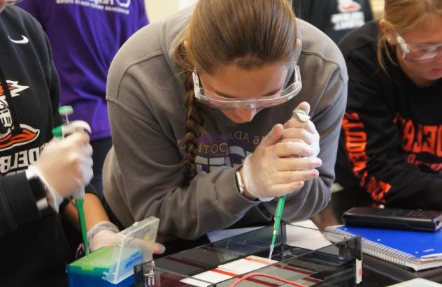 student with pipette 